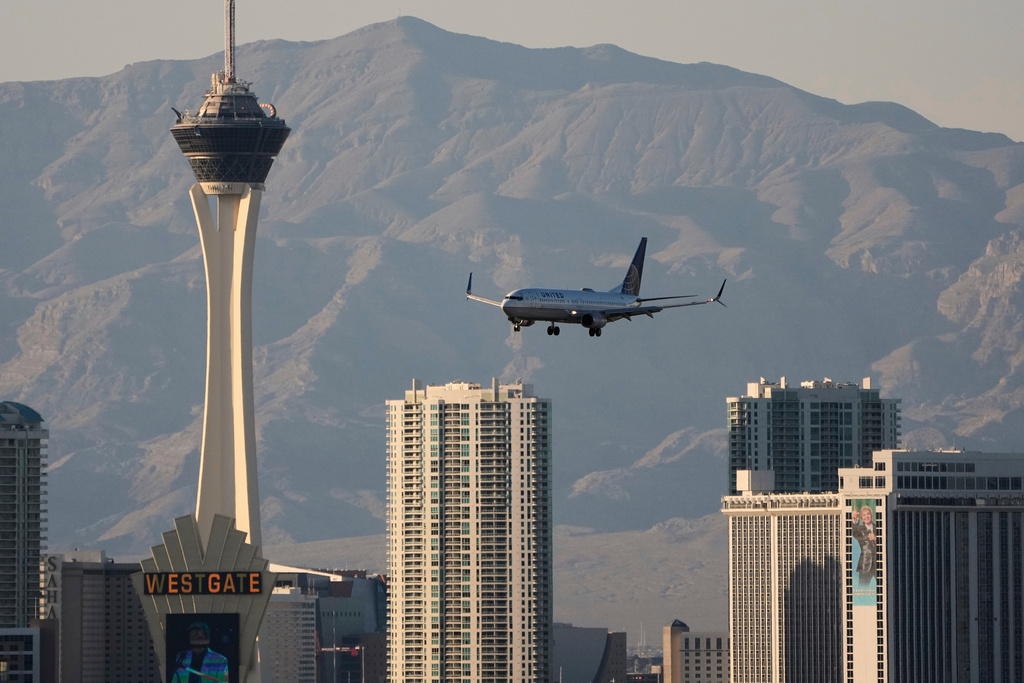 A United Airlines flight lands at Harry Reid International Airport, Wednesday, April 9, 2025, in Las Vegas. 