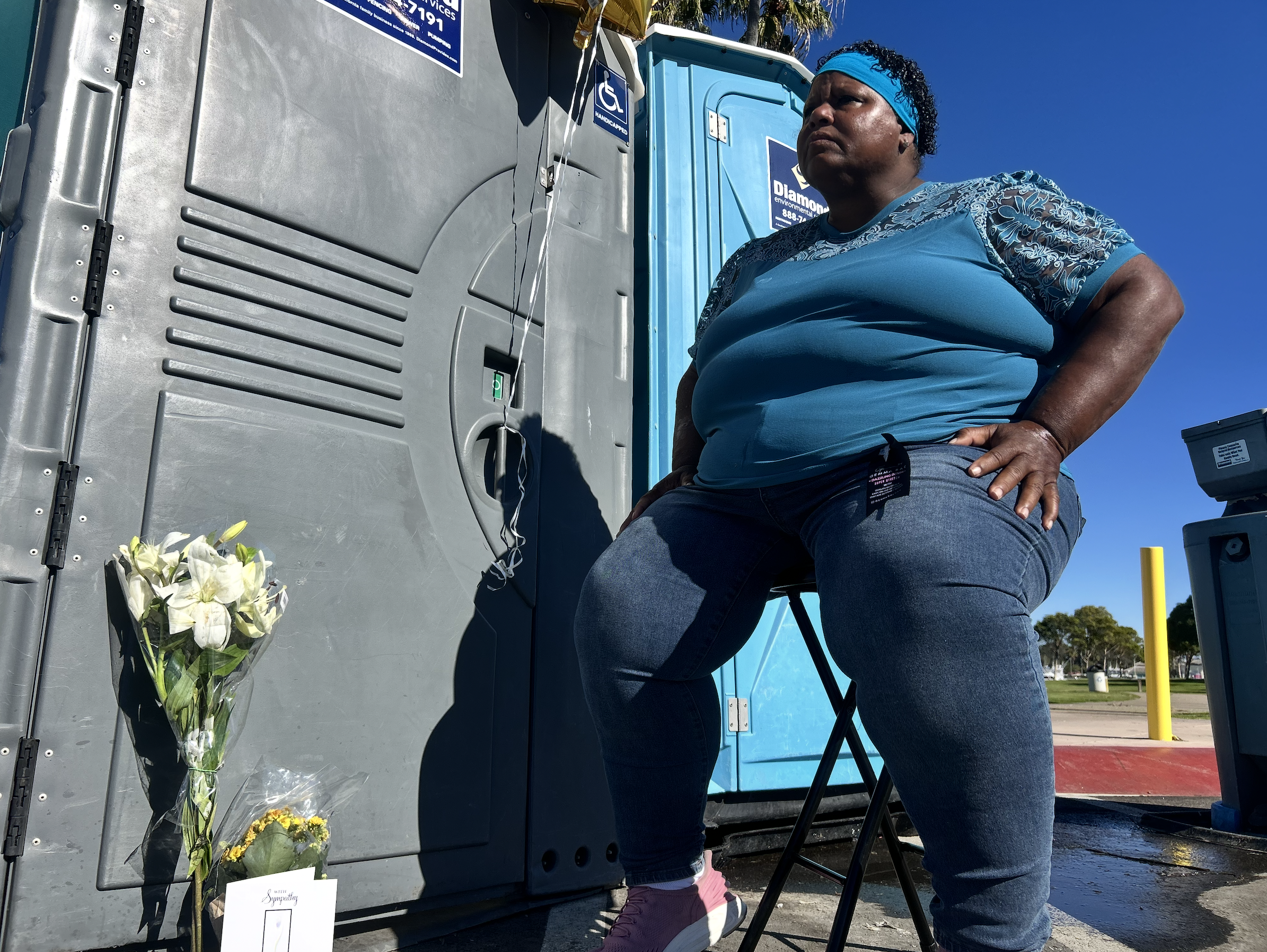 Cynthia Green was seen on Tuesday guarding the porta-potty where the infant was discovered. She did not know the baby.