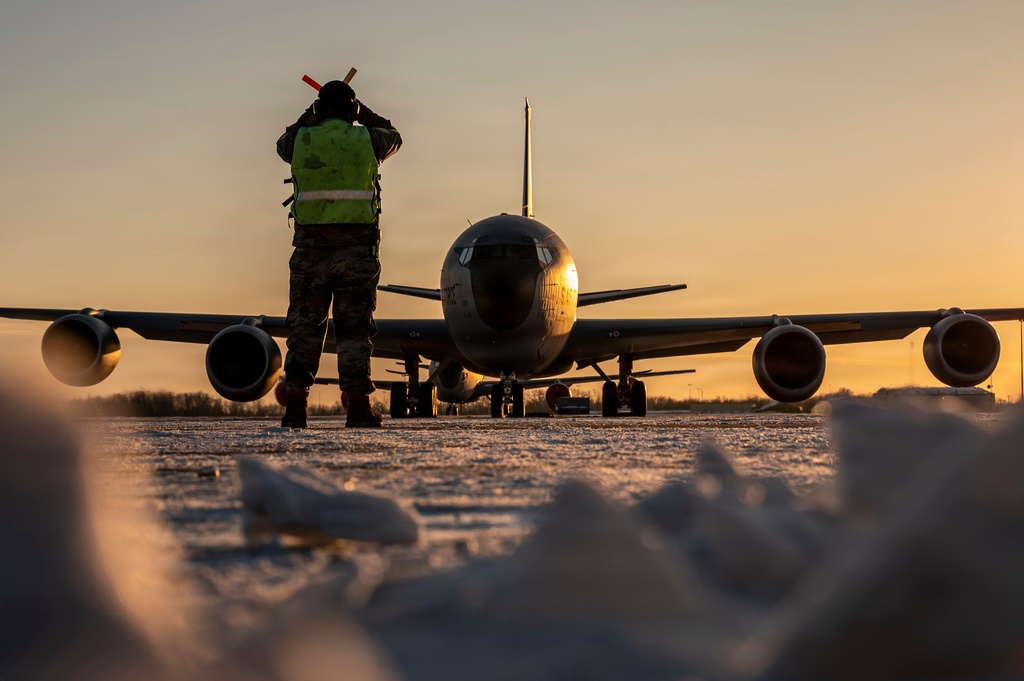 In this Jan. 28, 2026 photo, U.S. Air Force Master Sgt. Aaron Slupski, a crew chief with the 121st Maintenance Group, prepares to marshal a KC-135 Stratotanker at Rickenbacker Air National Guard Base, Columbus, Ohio.