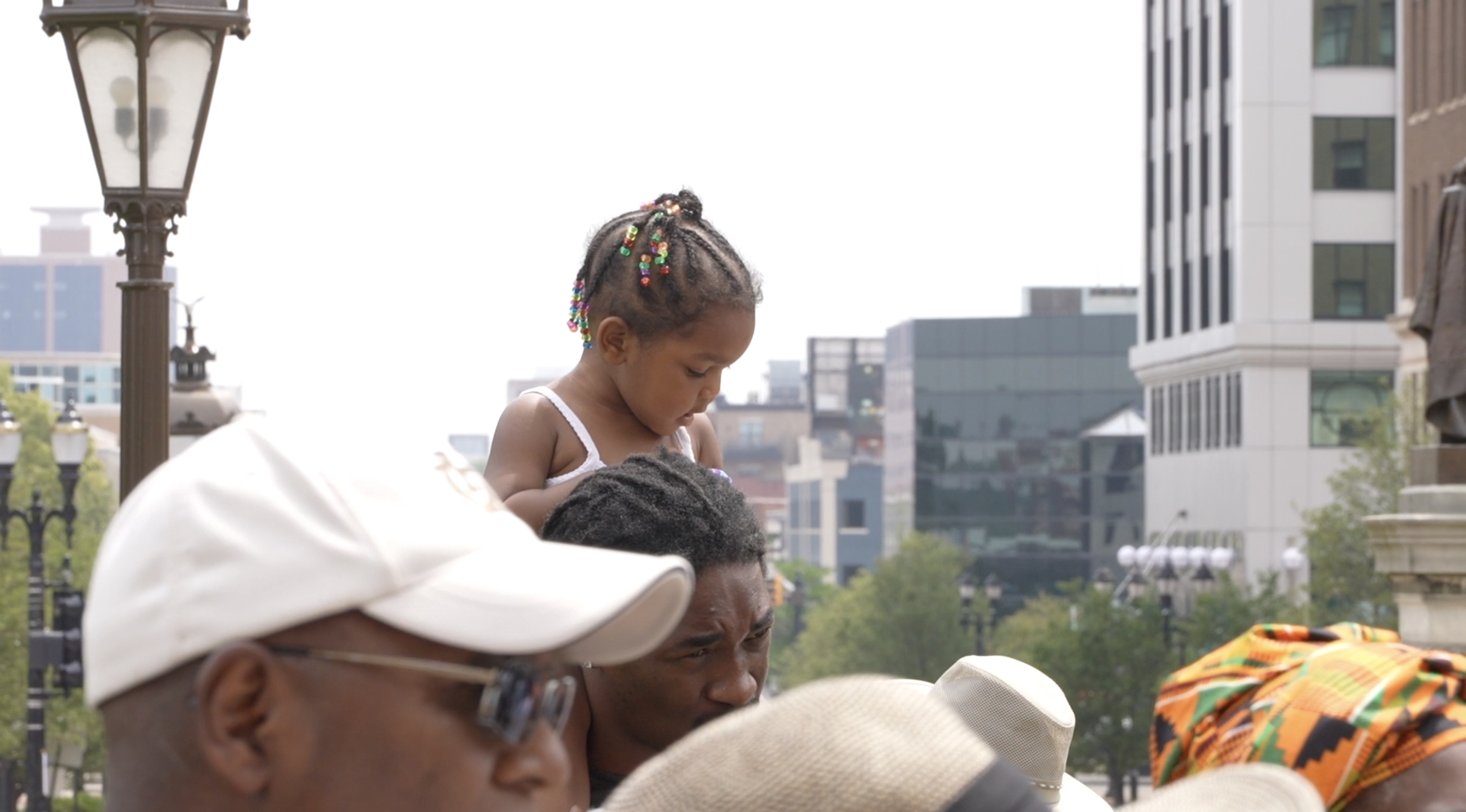 Father and daughter at Lansing juneteenth celebration