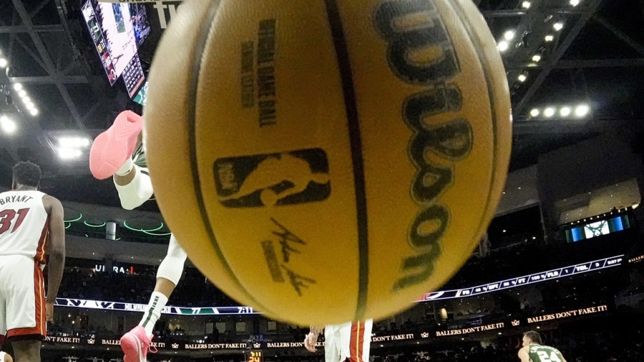 Milwaukee Bucks' Giannis Antetokounmpo dunks during the second half of an NBA basketball game.