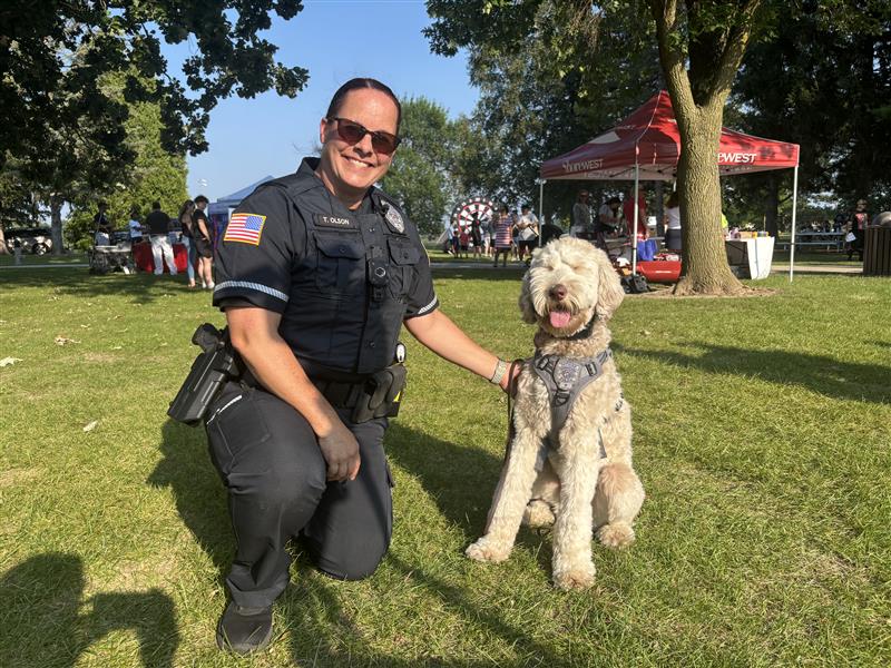 School resource officer Toni Olson walked therapy dog Archie around so he could see his Germantown School District friends at their Neighbors Against Crime Night Out event