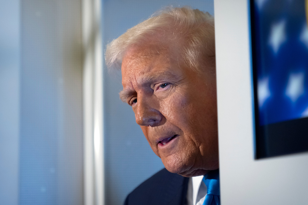 President Donald Trump speaks to reporters aboard Air Force One as he travels from Tokyo, Japan, to South Korea, Wednesday, Oct. 29, 2025.