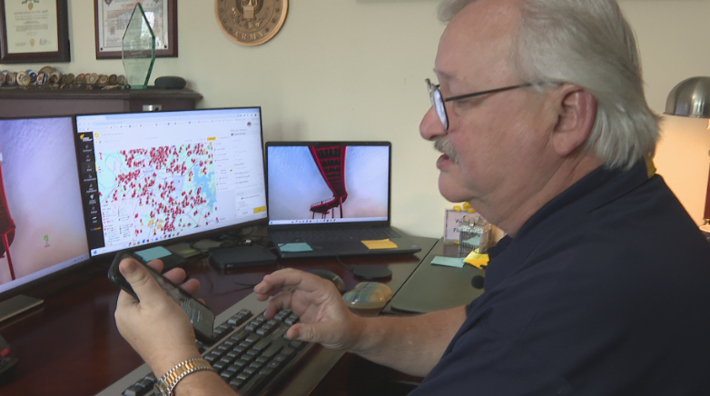 Volunteers answering Crisis Cleanup Hotline calls to help storm victims with free tree removal