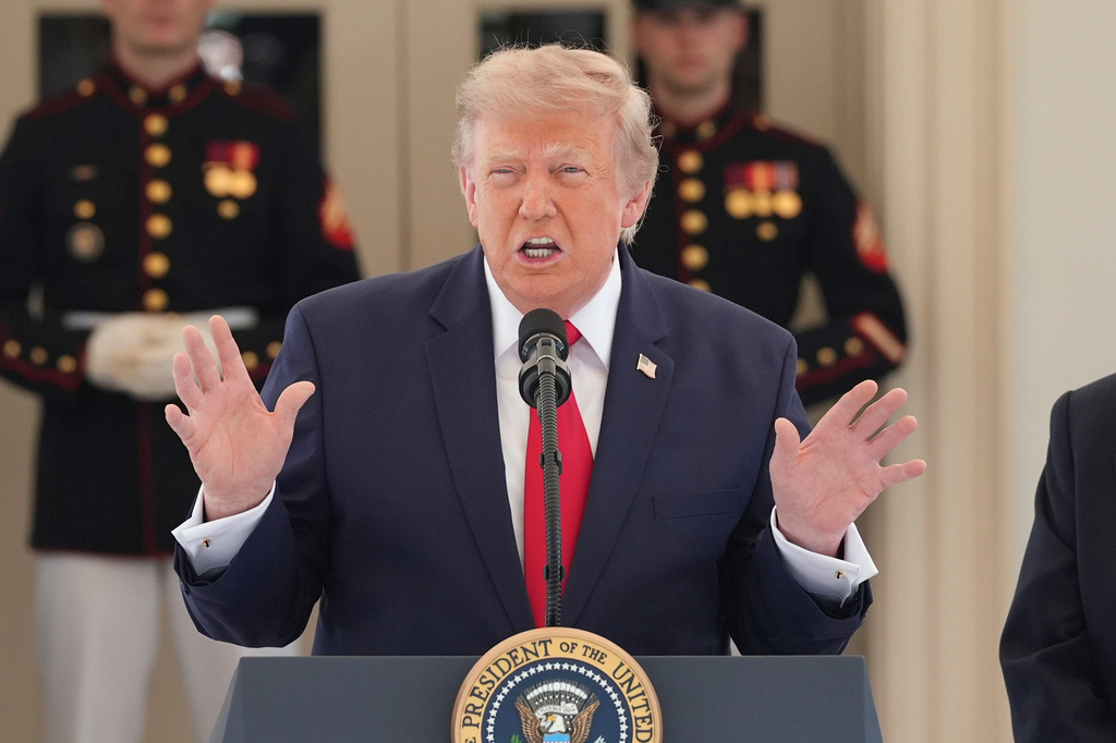 President Donald Trump speaks on West Executive Drive at the White House during a showcase for the upcoming Freedom 250 Grand Prix auto race, Monday, July 13, 2026, in Washington.