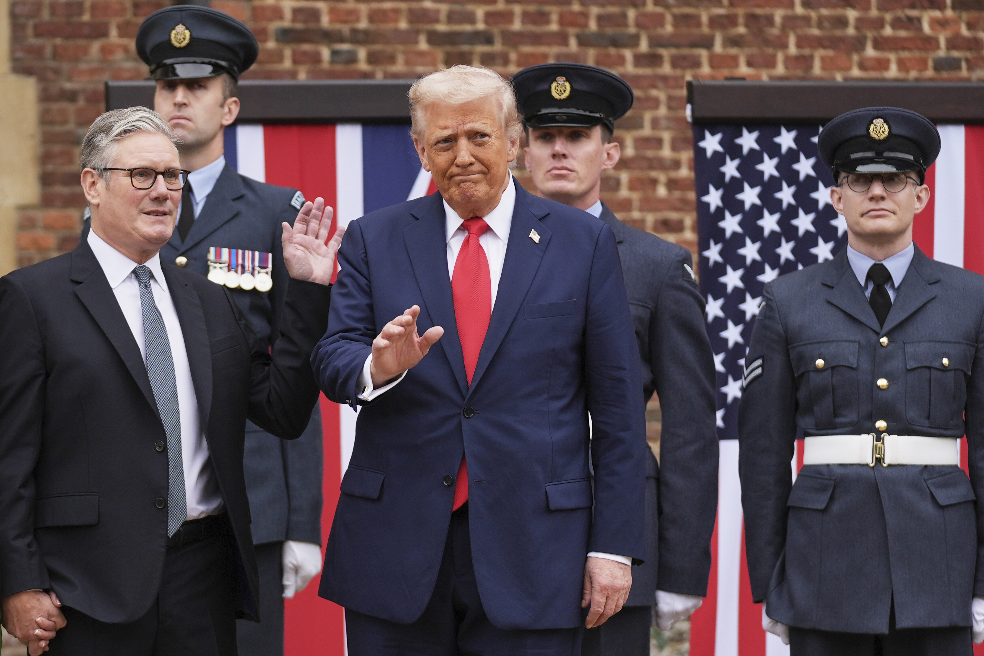 President Donald Trump waves next to Britain's Prime Minister Keir Starmer upon arriving at Chequers near Aylesbury, England, Thursday, Sept. 18, 2025. 