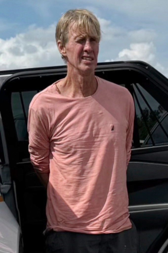 In this image released by the Martin County, Fla., Sheriff's Office, law enforcement officers arrest Ryan Wesley Routh, a man suspected in an apparent assassination attempt of Donald Trump, Sept. 15, 2024.