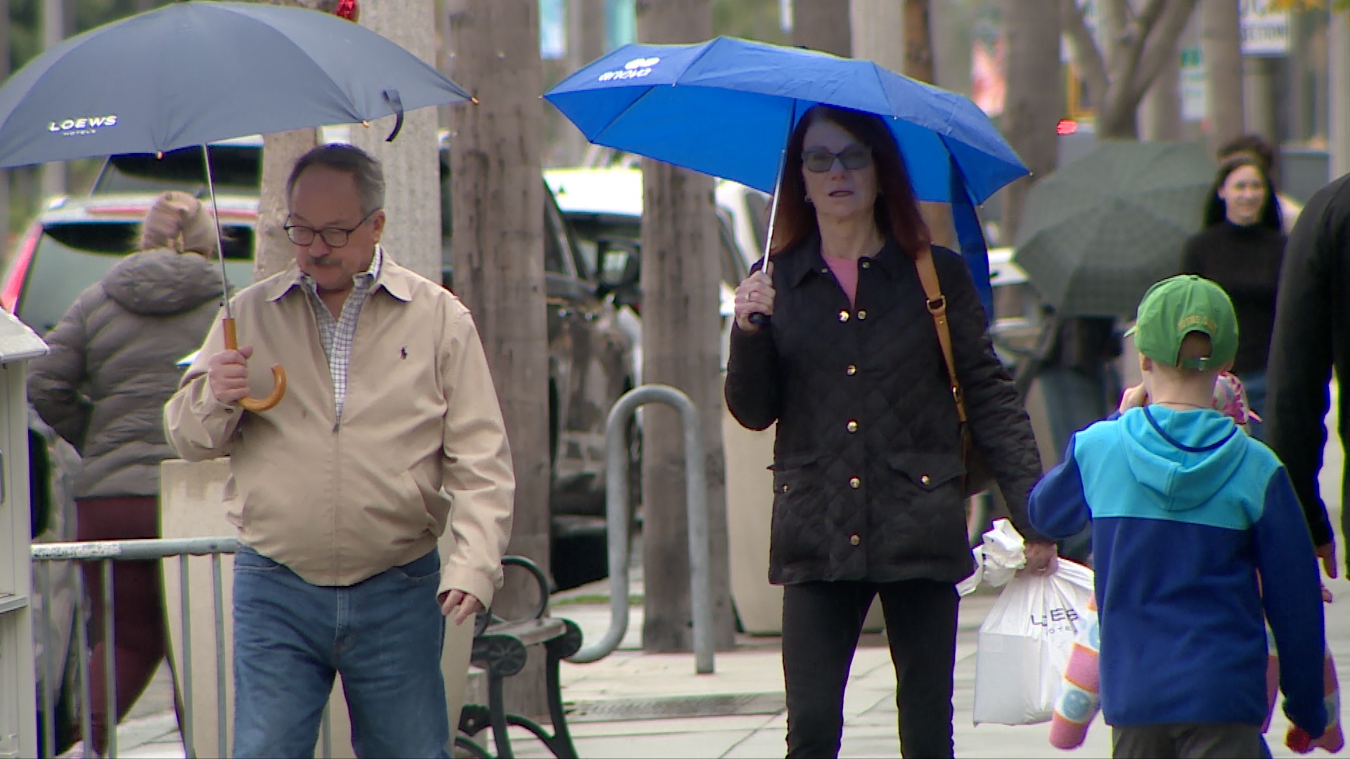 People walking in Coronado on a rainy New Year's Eve. 