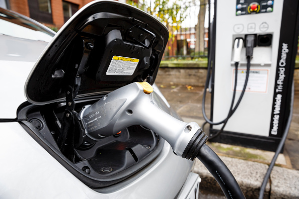 Go Ultra Low Electric Vehicle on charge on a London street