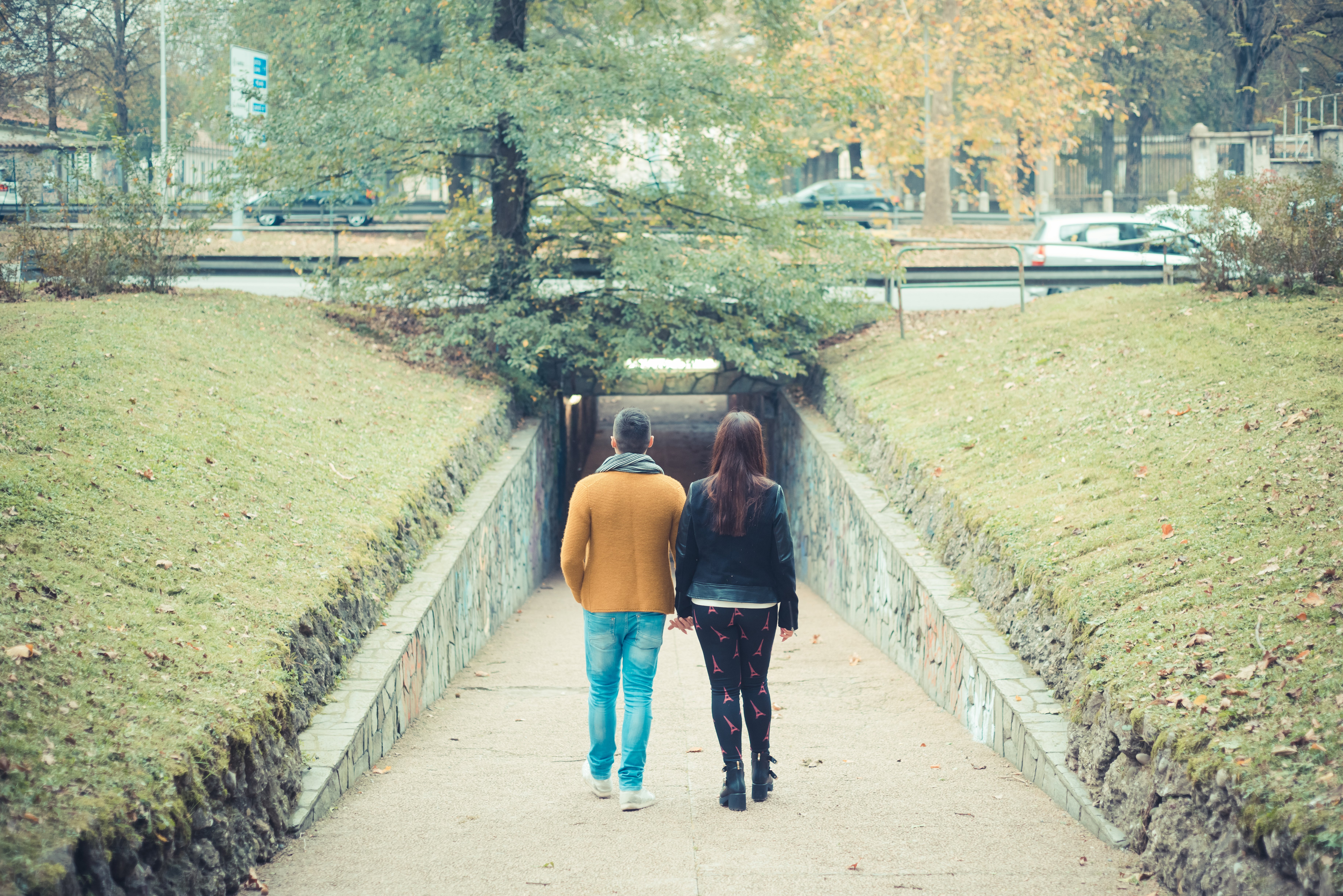 young couple in the park during autumn season outdoor