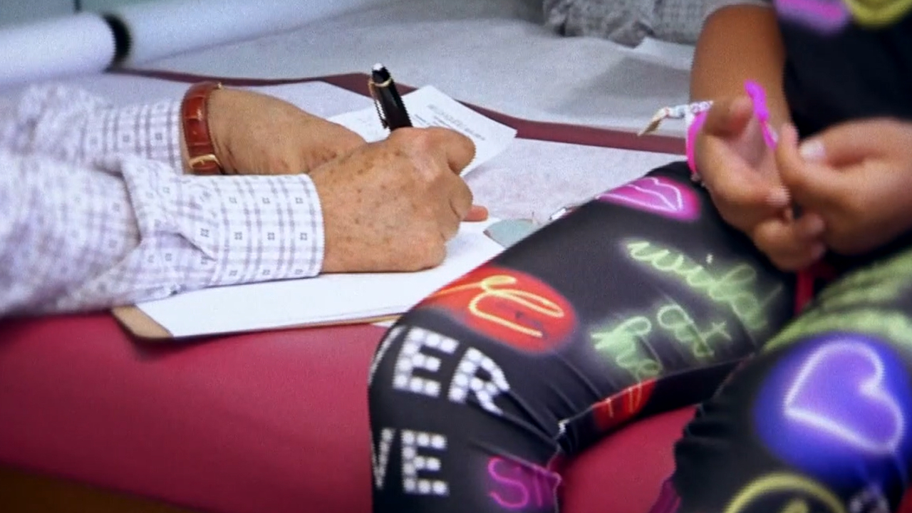 A pediatrician treats a child for COVID-19, 2021.jpg