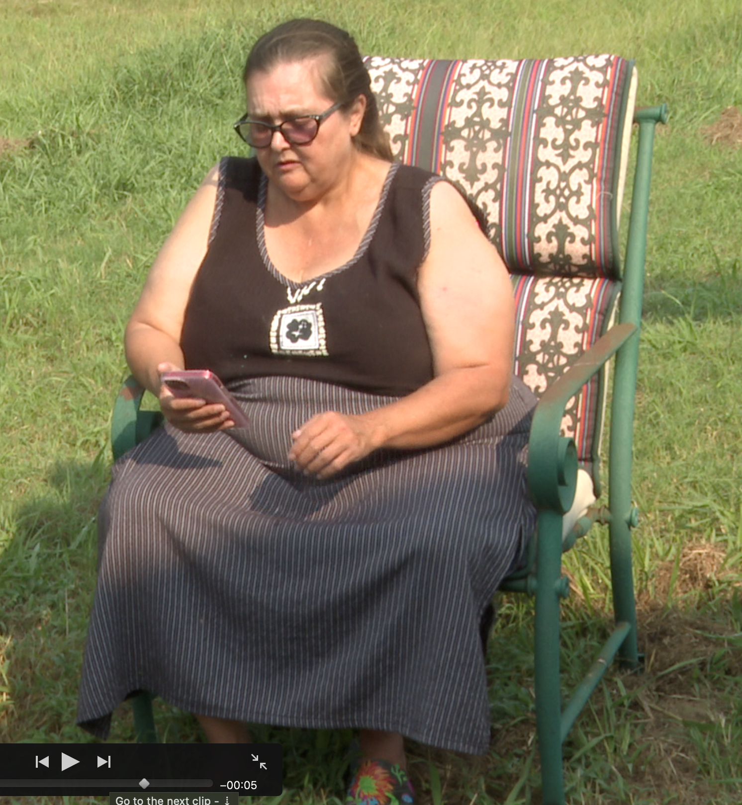 Donna looking at telemarketer call.png