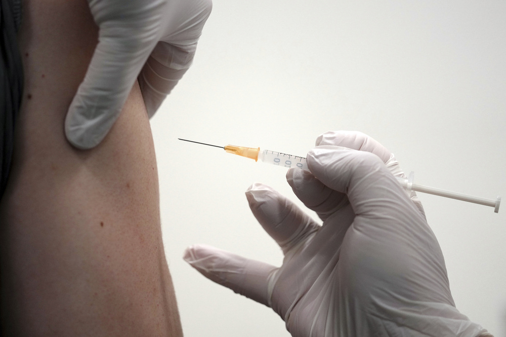  A local resident receives the Moderna COVID-19 vaccine shot at a center, June 30, 2021, in the Sumida ward of Tokyo.