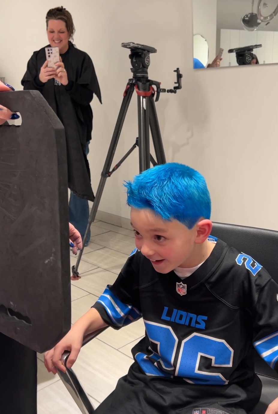 7-year-old James Kloposki checking out his new hair