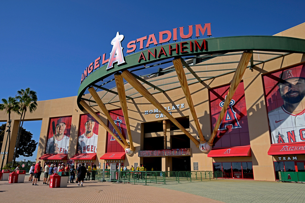 FILE - People line up outside Angel Stadium prior to a baseball game between the Los Angeles Angels and the Cleveland Guardians, Aug. 24, 2026, in Anaheim, Calif.
