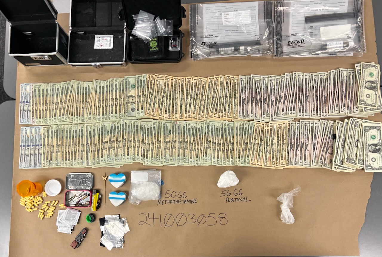Police photo of drugs and guns retrieved from 800 block of Murray Ave