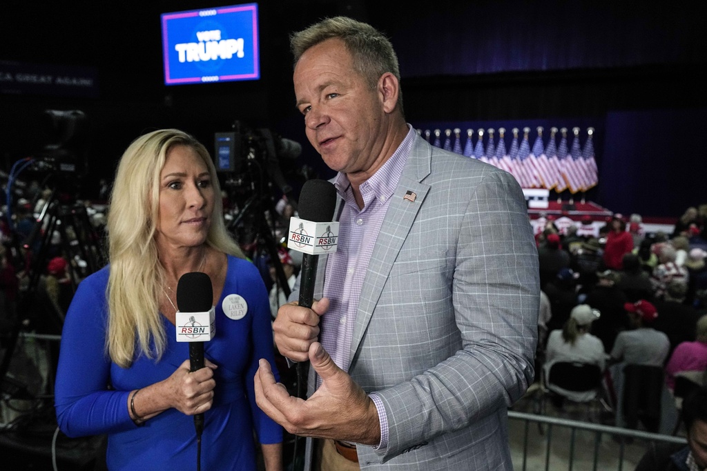 Right Side Broadcasting Network reporter Brian Glenn interviews Rep. Marjorie Taylor Greene, R-Ga., before Republican presidential candidate former President Donald Trump speaks in Rome, Ga., on Saturday, March 9, 2024. 