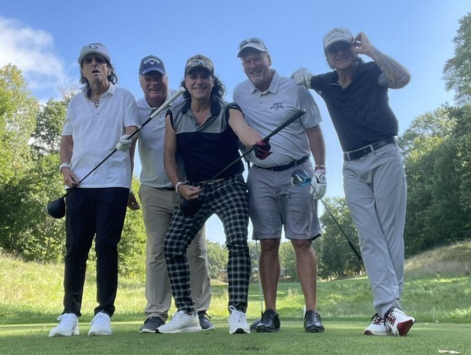 Alice Cooper and GRCC golf coaches.jpg
