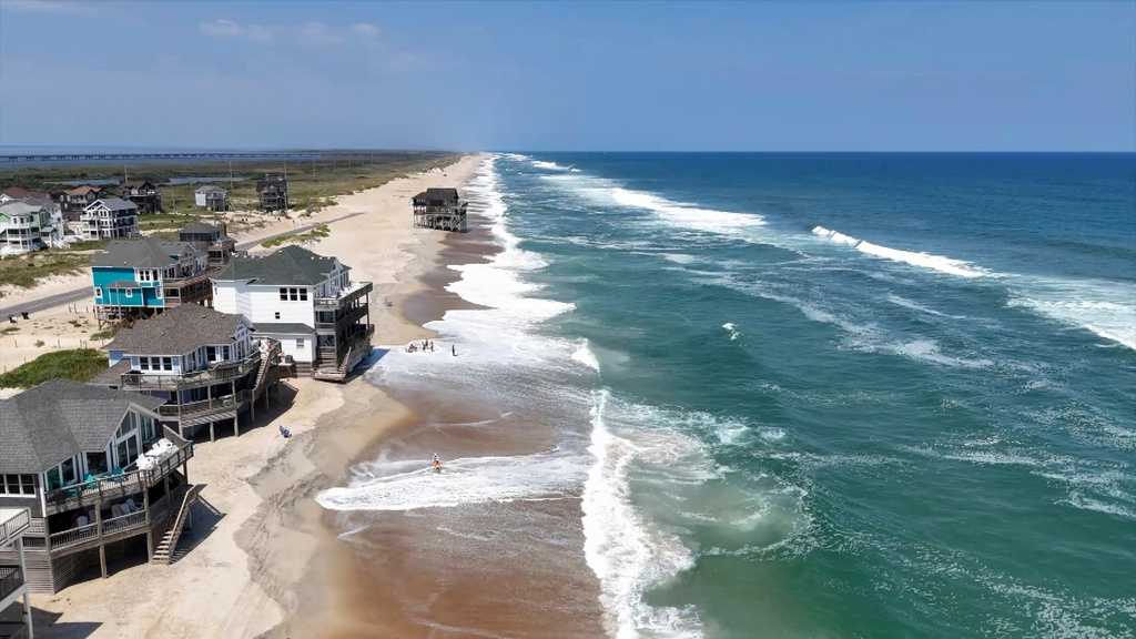 In this aerial image taken from video provided by WVEC-TV, homes along the Atlantic Coast in Dare County, N.C., are seen, Monday, Aug. 18, 2025, ahead of expected impacts from Hurricane Erin. 