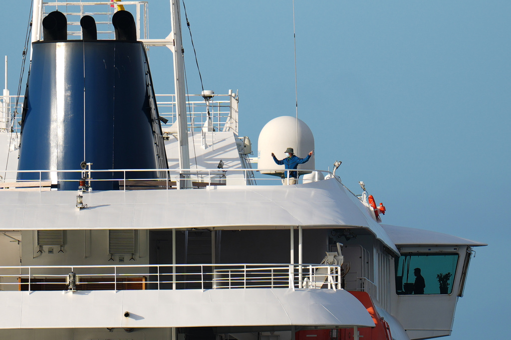 Passengers and crew at the hantavirus-stricken cruise ship MV Hondius after arriving at the port of Granadilla in Tenerife, Canary Islands, Spain, Sunday, May 10, 2026. 
