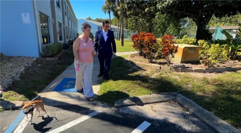 Sherri Kelley's spine was injured when she fell while walking her dog