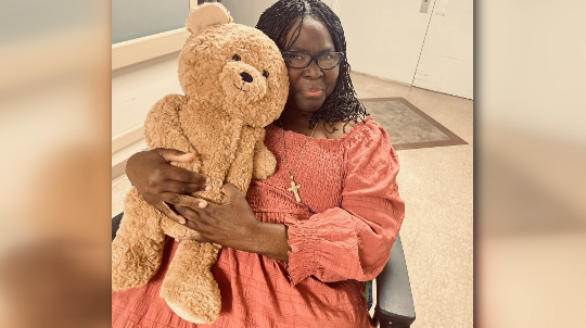 resident with teddy bear