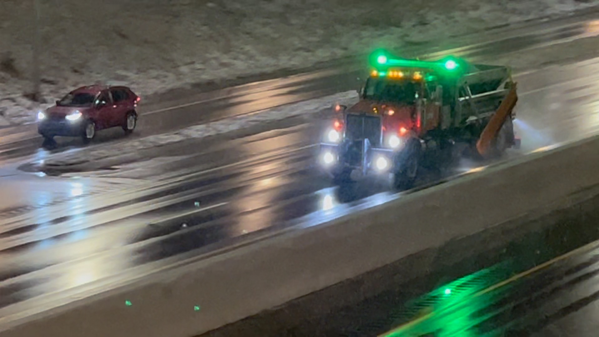 Plow salting the roads on New Year's Eve
