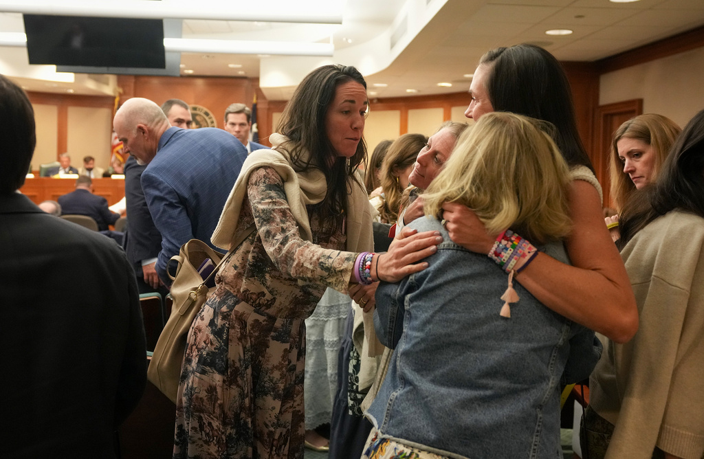 CiCi Steward, left, whose 8-year-old daughter, Cile Steward, died in the July 4, 2025, flood at Camp Mystic, gathers with other mothers after a joint House and Senate flood investigating committee hearing at the Capitol in Austin, Texas, Tuesday April 28, 2026.