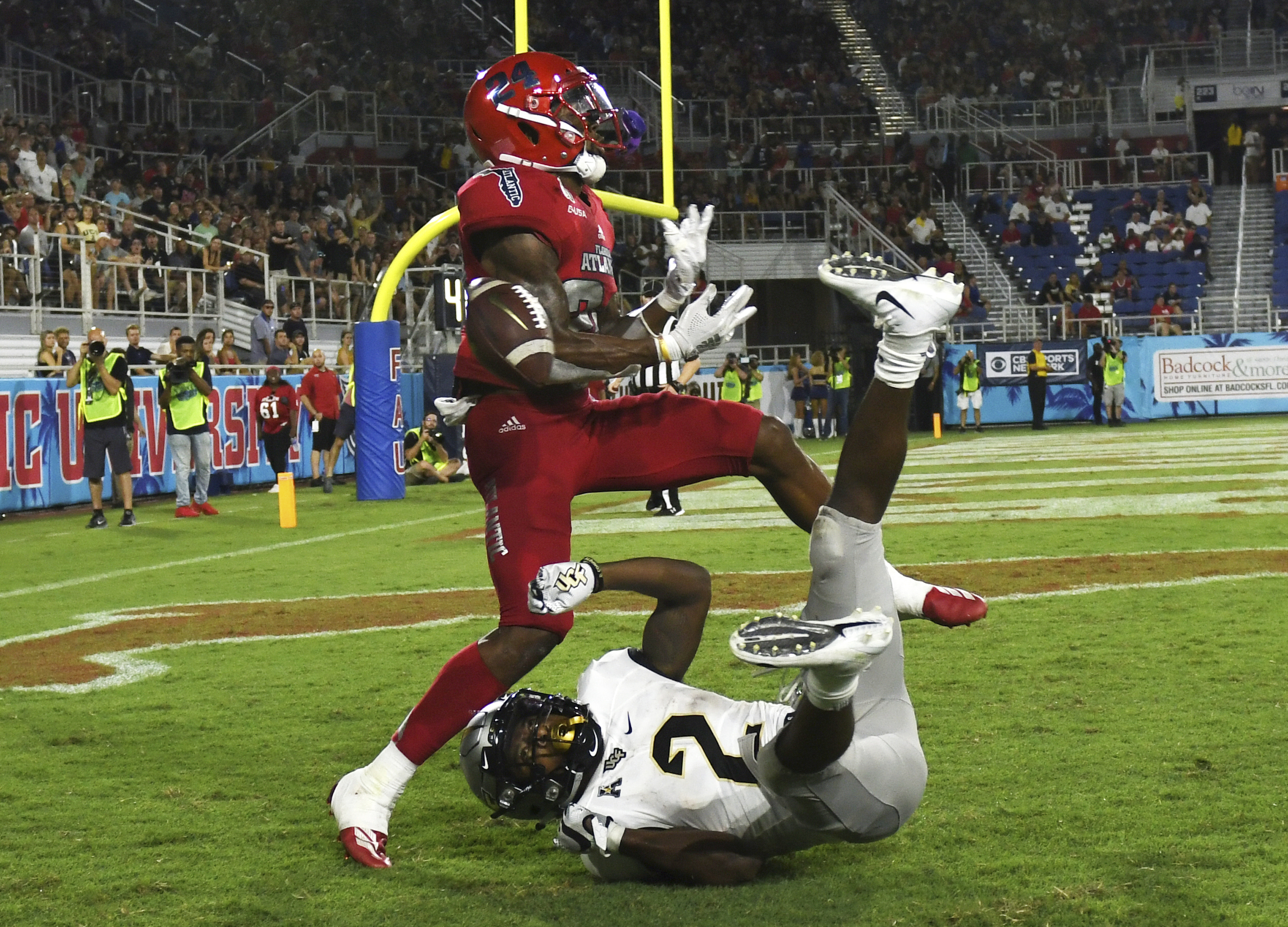 FAU Owls safety Zyon Gilbert deflects pass intended for UCF Knights running back Otis Anderson, Sept. 7, 2019, at FAU Stadium in Boca Raton