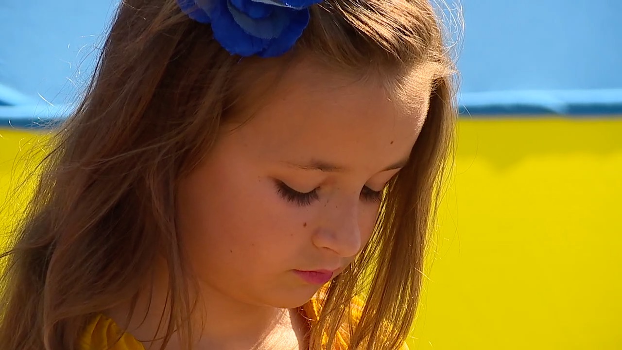 Ukrainian girl attends rally in Balboa Park