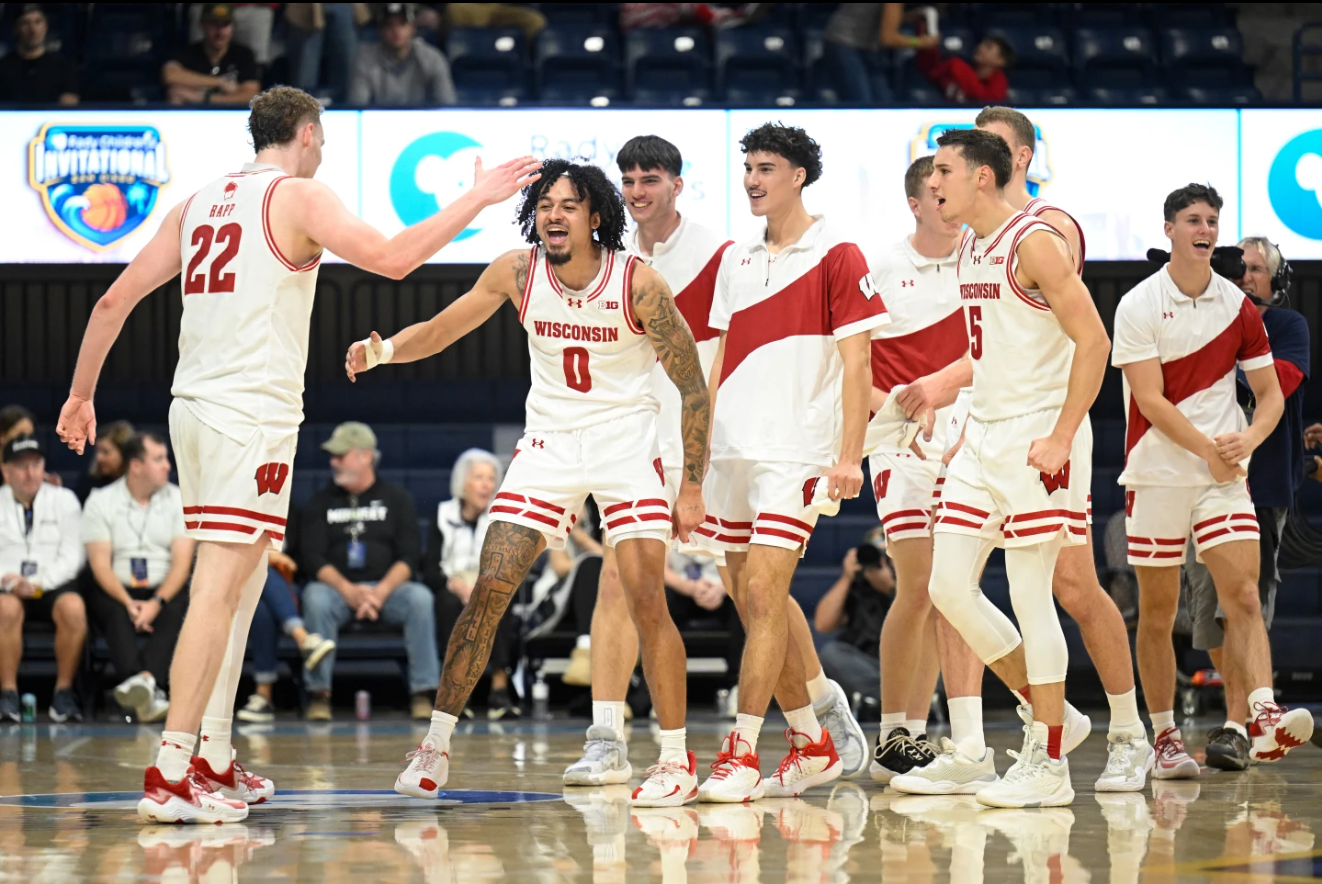 Wisconsin players celebrate at the end of the first half of an NCAA college basketball game in the Rady Children's Invitational tournament against Providence, Thursday, Nov. 27, 2025, in San Diego, Ca.