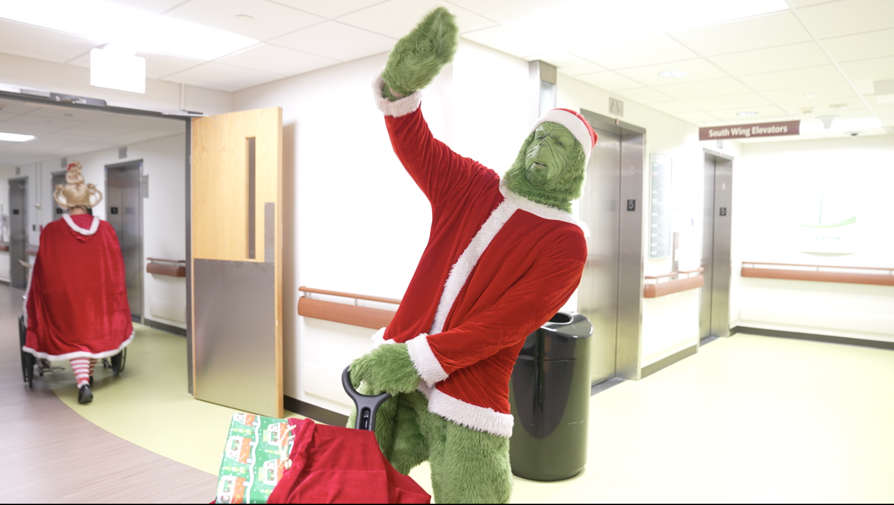 The Grinch and Cindy Lou Who are dropping off presents at Sparrow Hospital.