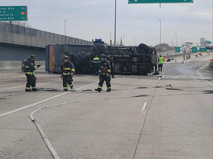 trash truck rollover i-25.jpg