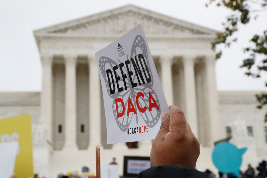 People rally outside the Supreme Court in support of the Deferred Action for Childhood Arrivals program (DACA), in Washington, Nov. 12, 2019. 
