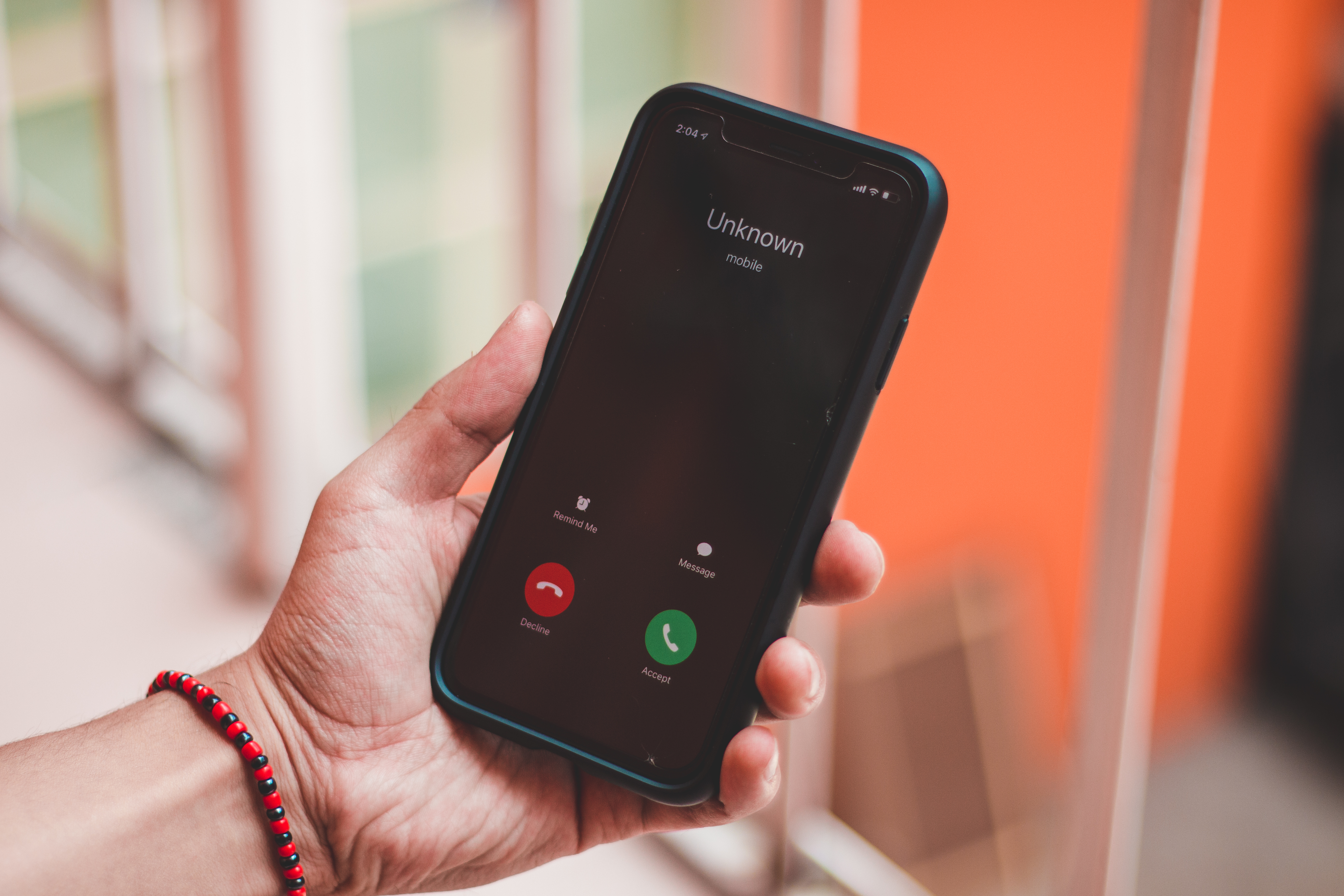 Stock image of an unknown caller popping up on a smartphone.