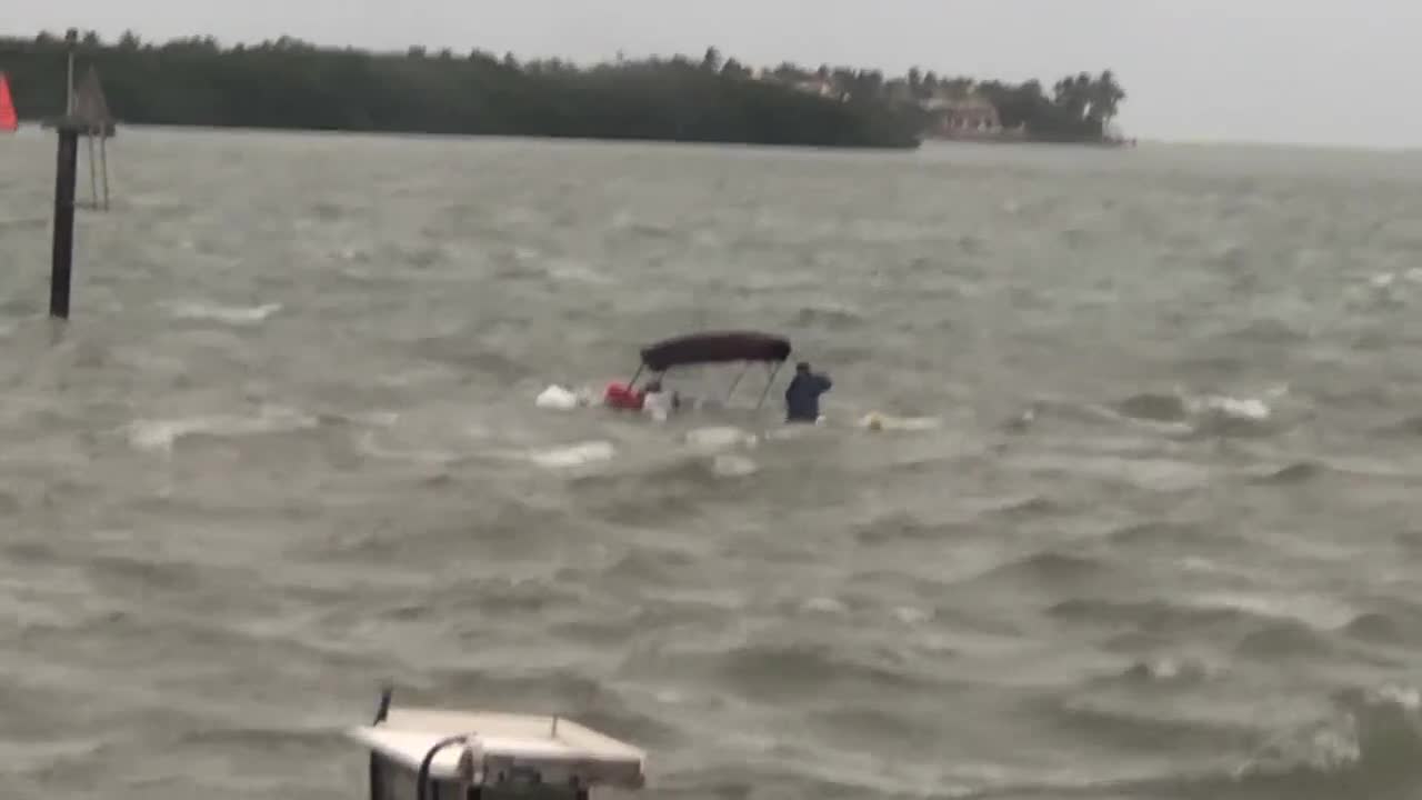 Closeup of sinking boat in Intracoastal Waterway in Martin County