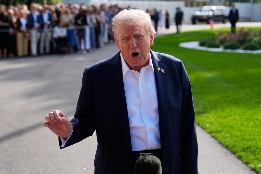 President Donald Trump speaks with reporters before departing the White House, Friday, Sept. 26, 2025, in Washington. 