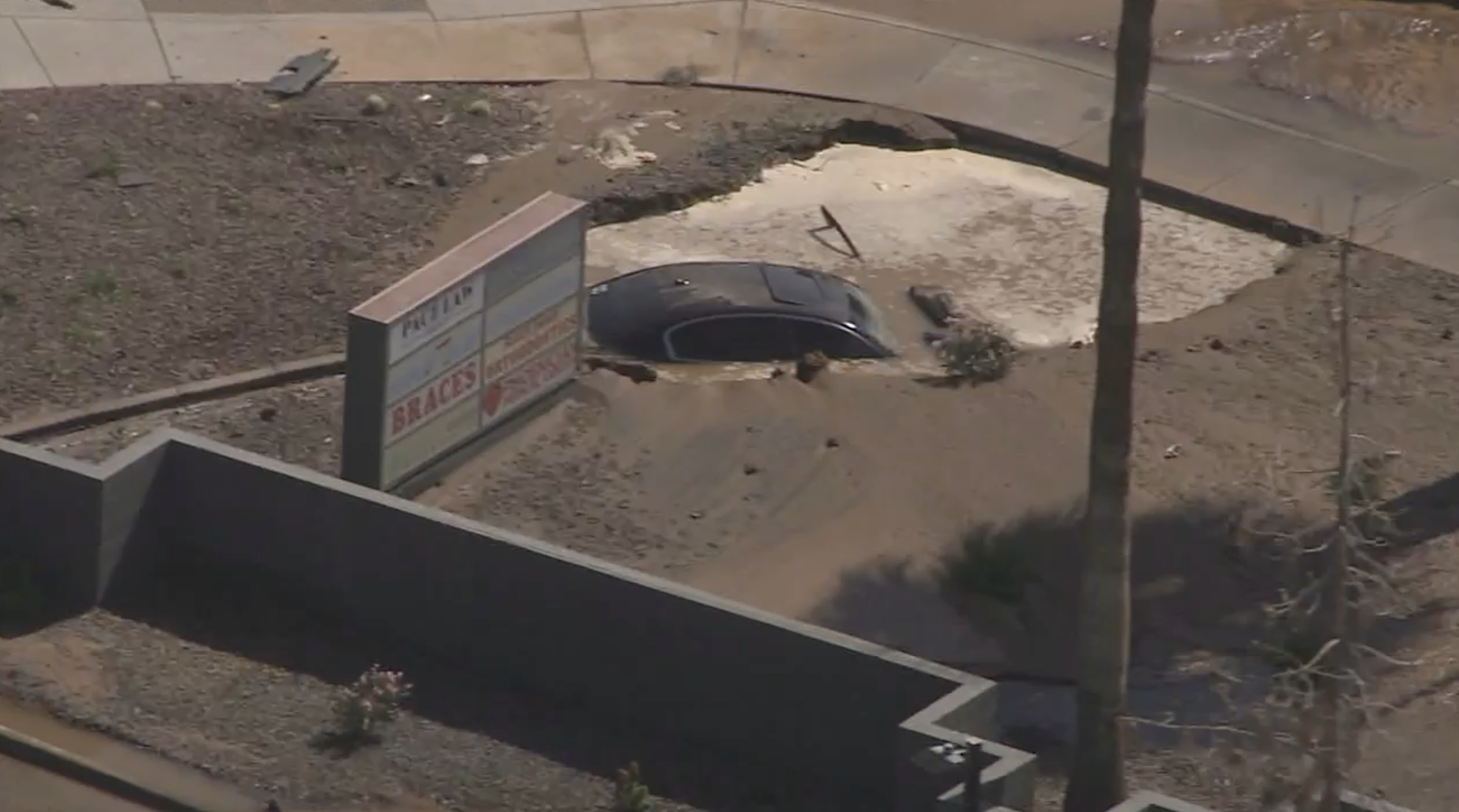 Car into sinkhole 5-8-24