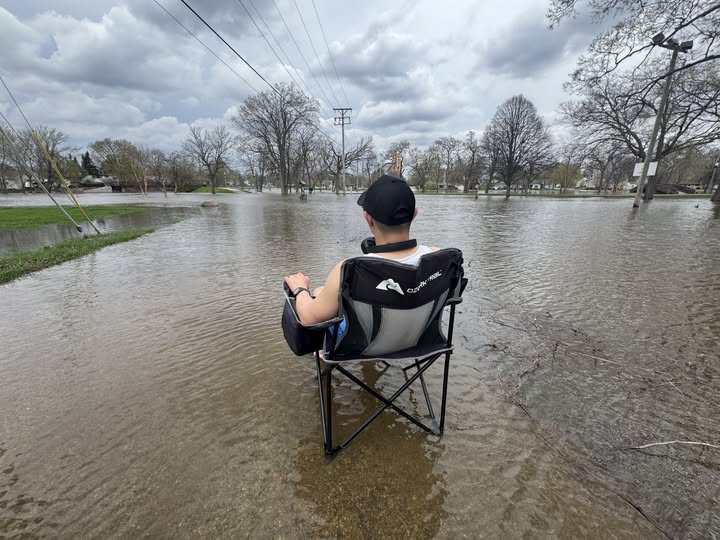 TMJ4's Mike Beiermeister captures a man sitting in chair in standing water at Wehmhoff Jucker Park in Burlington on Friday, April 17, 2026.