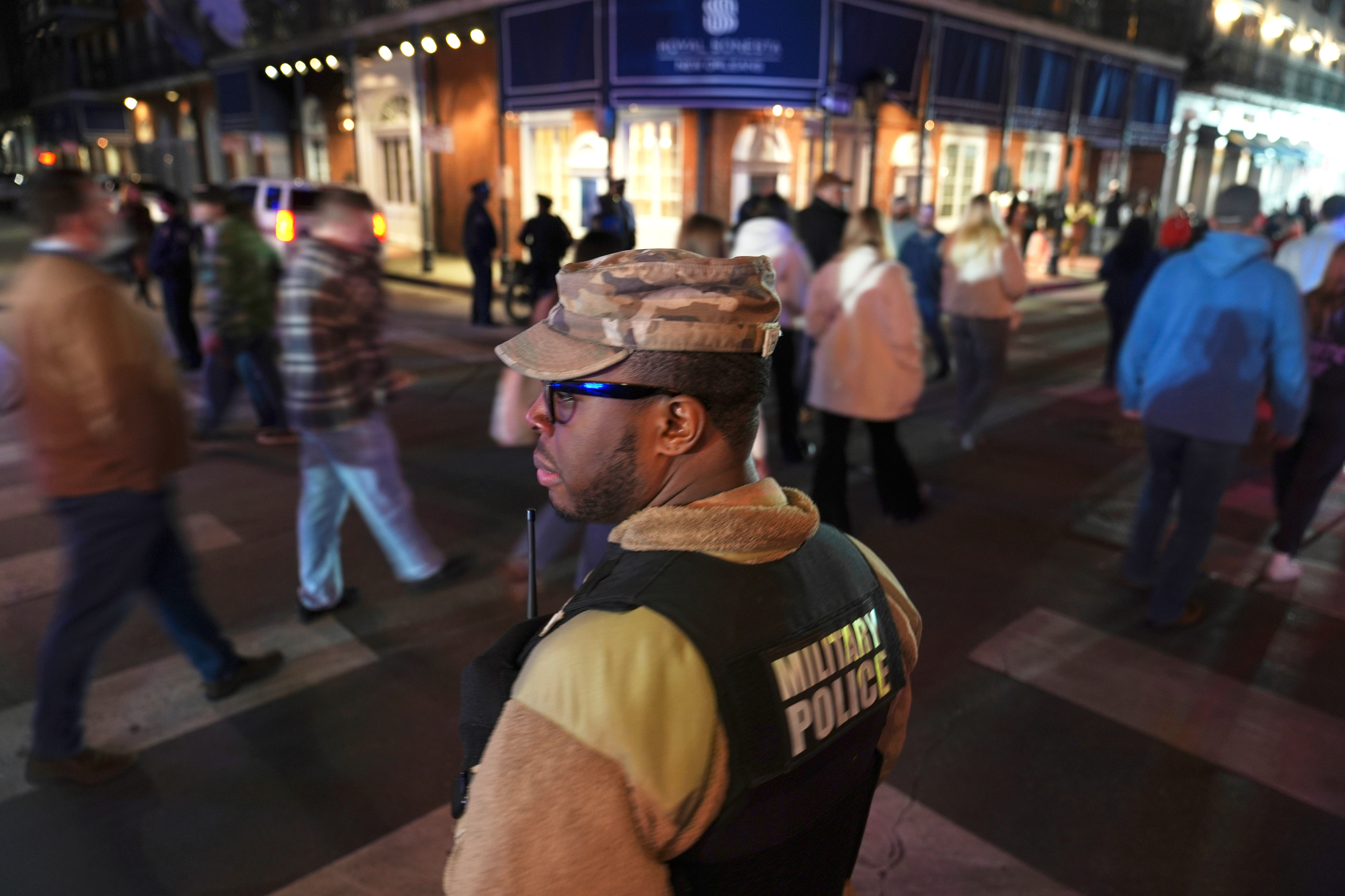 Spc. Nelson Harrison, of the Louisiana National Guard, stands guard on Bourbon Street in the French Quarter, Jan. 2, 2025, in New Orleans.