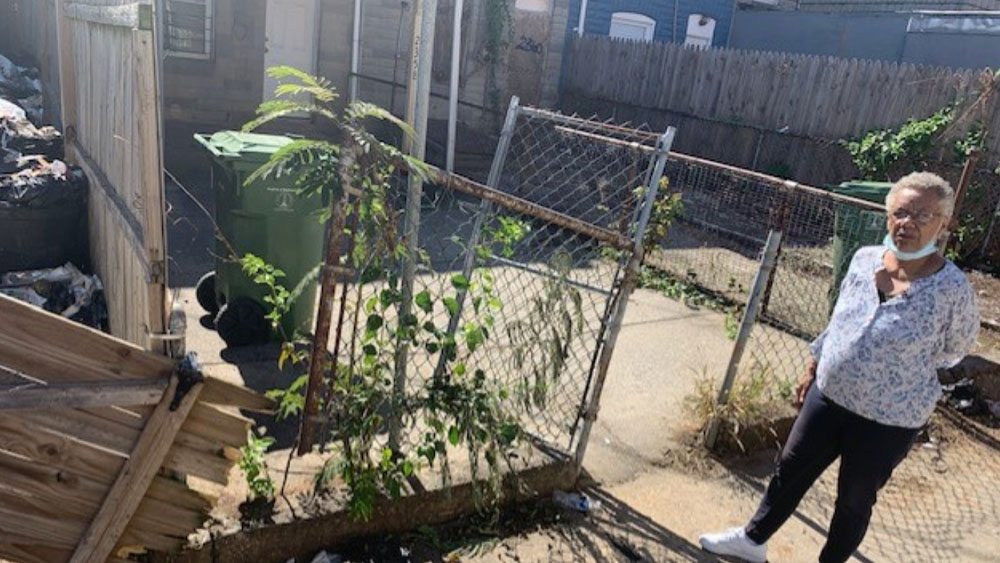 Woman says Baltimore City sanitation truck demolished her fence.jpg