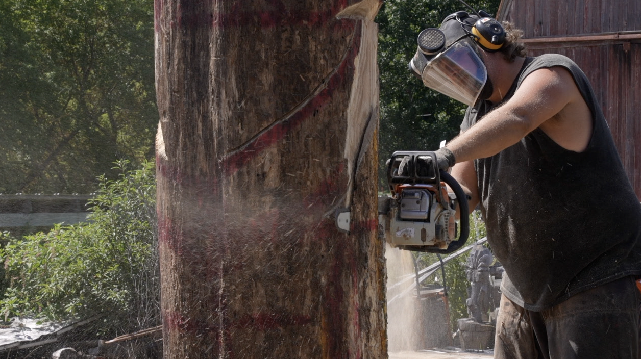 Mike Swagart carving the War of 1812 soldier statue
