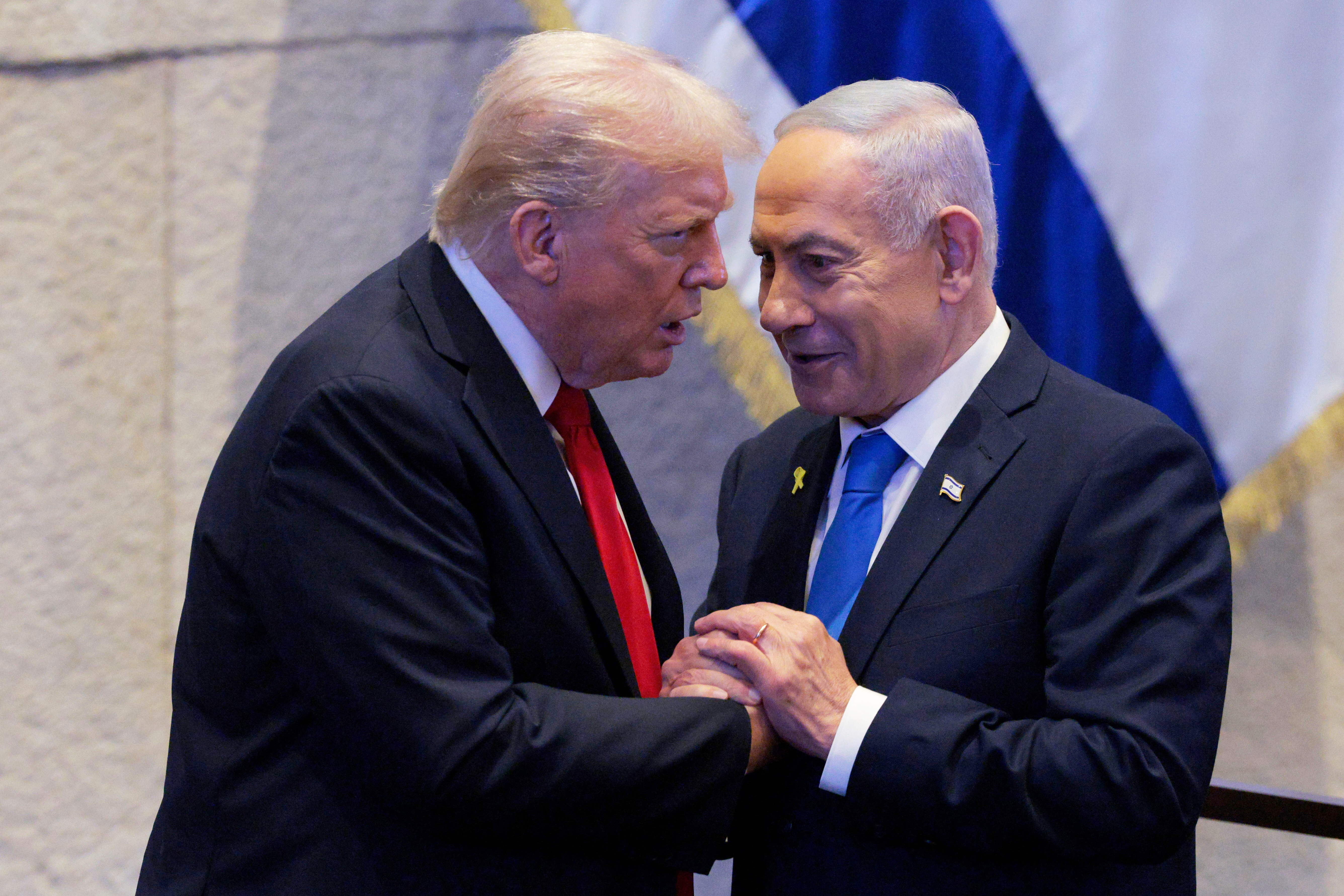 FILE - President Donald Trump talks with Israel's Prime Minister Benjamin Netanyahu at the Knesset, Israel's parliament, Monday, Oct. 13, 2025, in Jerusalem.