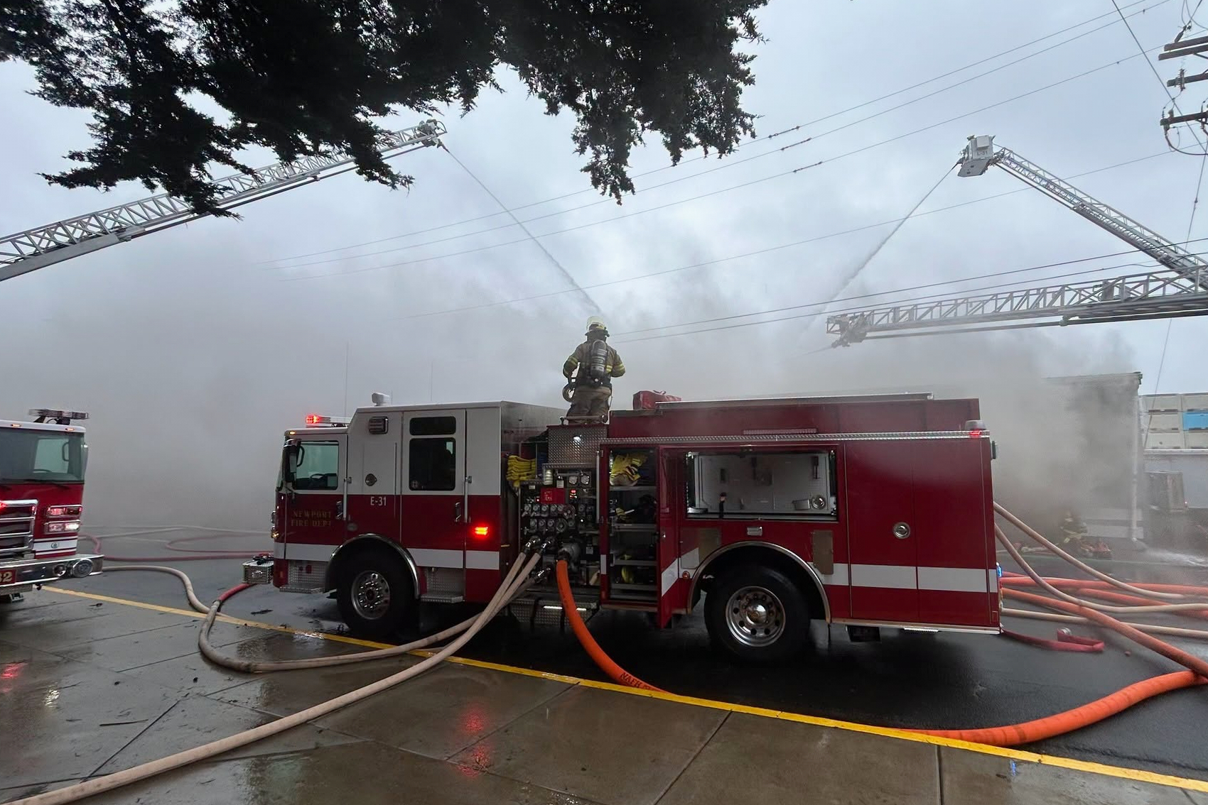 This photo provided by the Oregon State Fire Marshall shows firefighters trying to extinguish a fire at a seafood wholesaler in Newport, Ore., Sunday, Oct. 25, 2026.