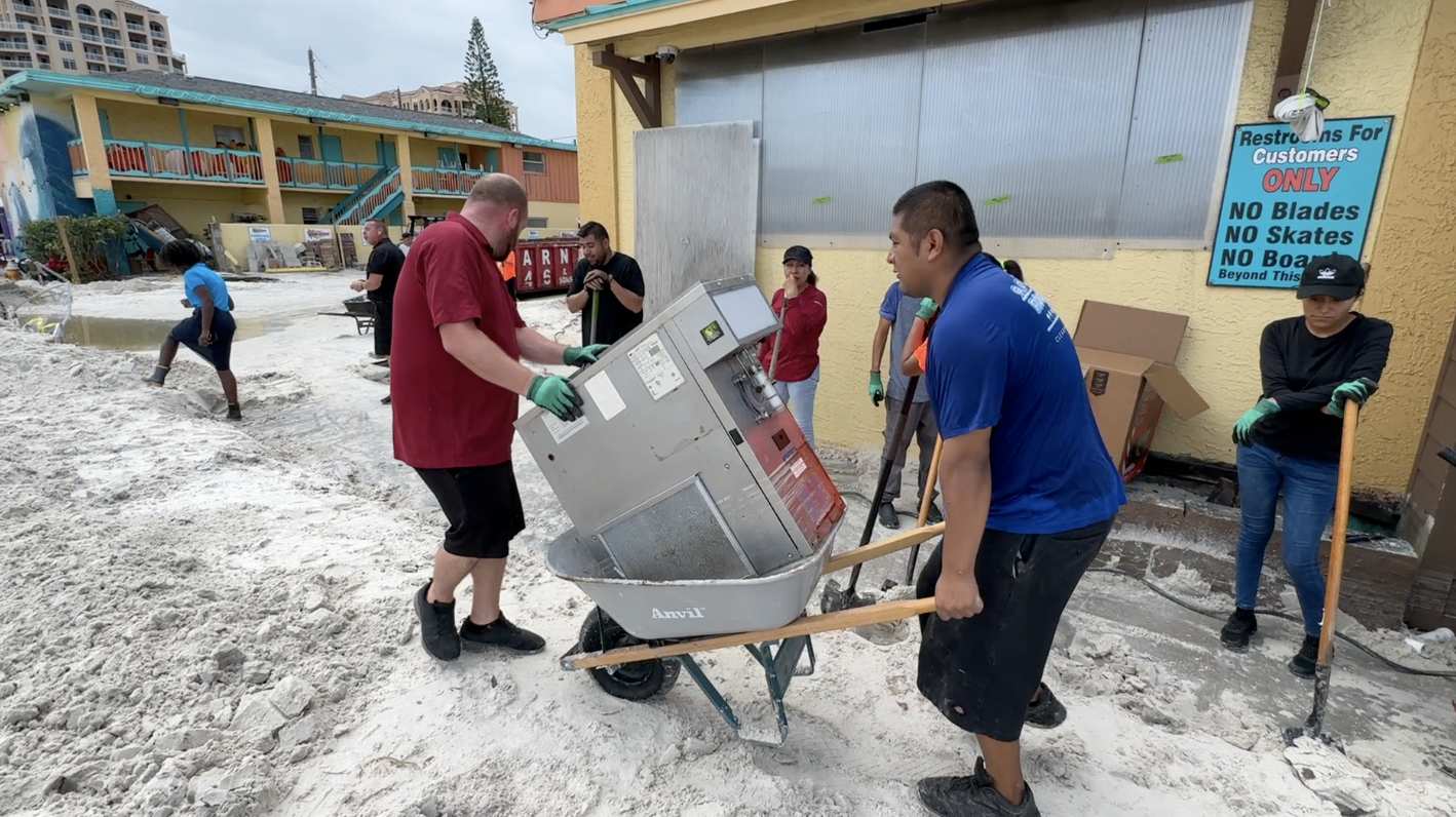 Residents move debris on Clearwater Beach