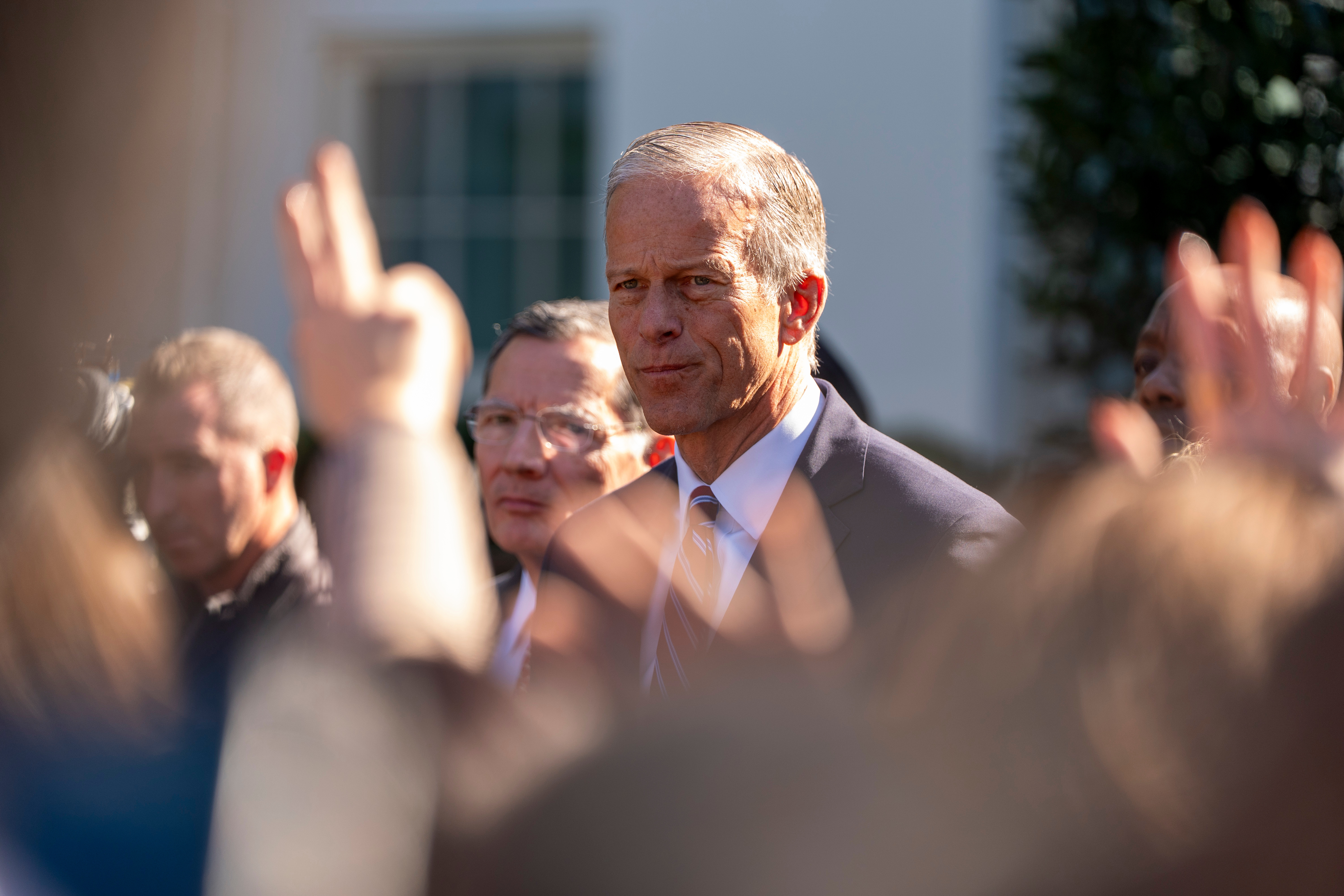 Senate Majority Leader John Thune, of S.D., center, and other republican Senate members, speak with reporters after a meeting with President Donald Trump at the White House, Tuesday, Oct. 21, 2025, in Washington. 