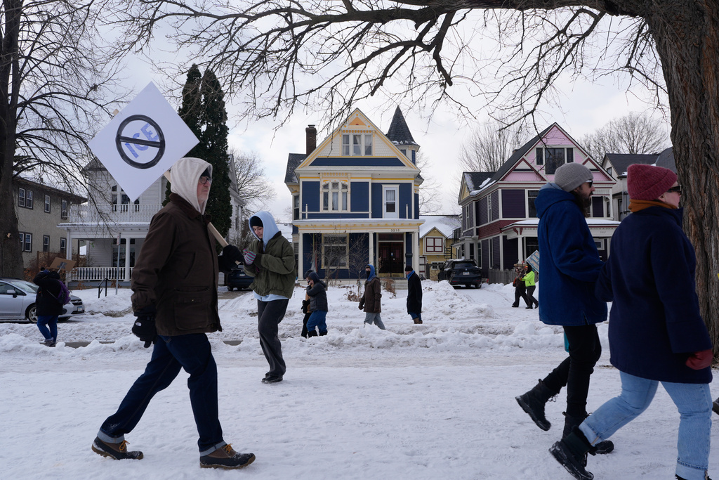 Protesters gather during a rally for Renee Good, who was fatally shot by an ICE officer earlier in the week, Friday, Jan. 10, 2026, in Minneapolis. 