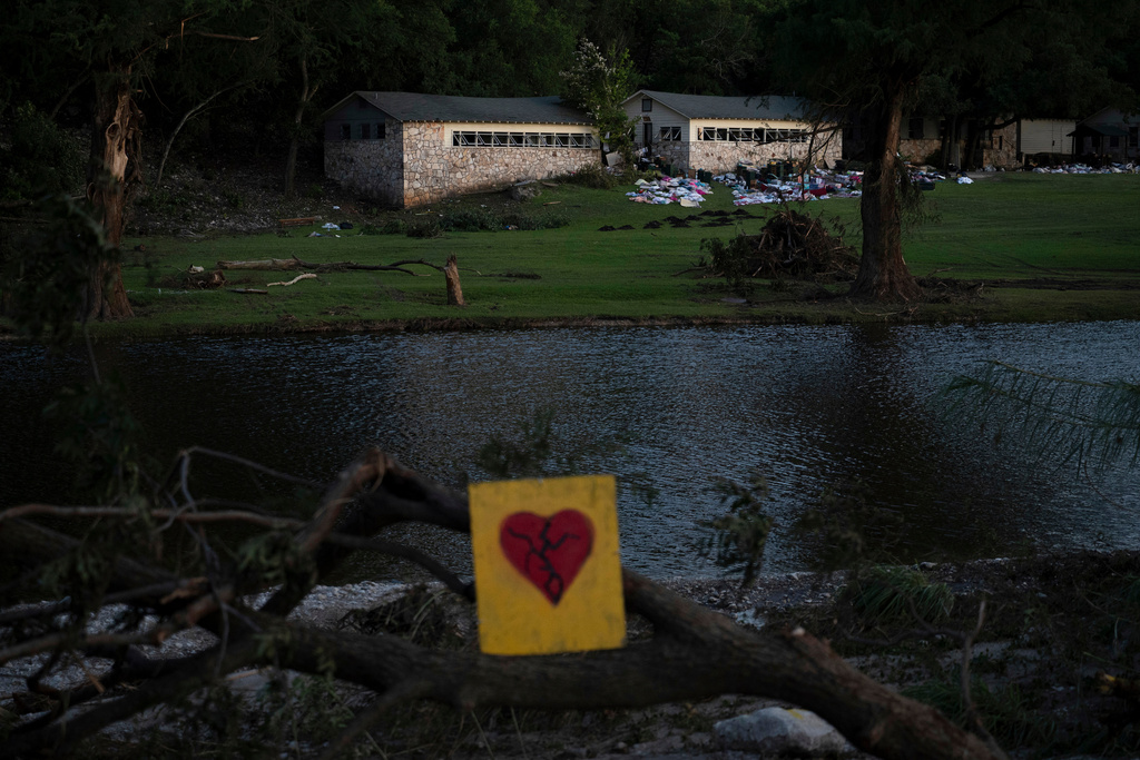 FILE - A broken heart sign is displayed near Camp Mystic July 8, 2025, after a flash flood swept through the area in Hunt, Texas.