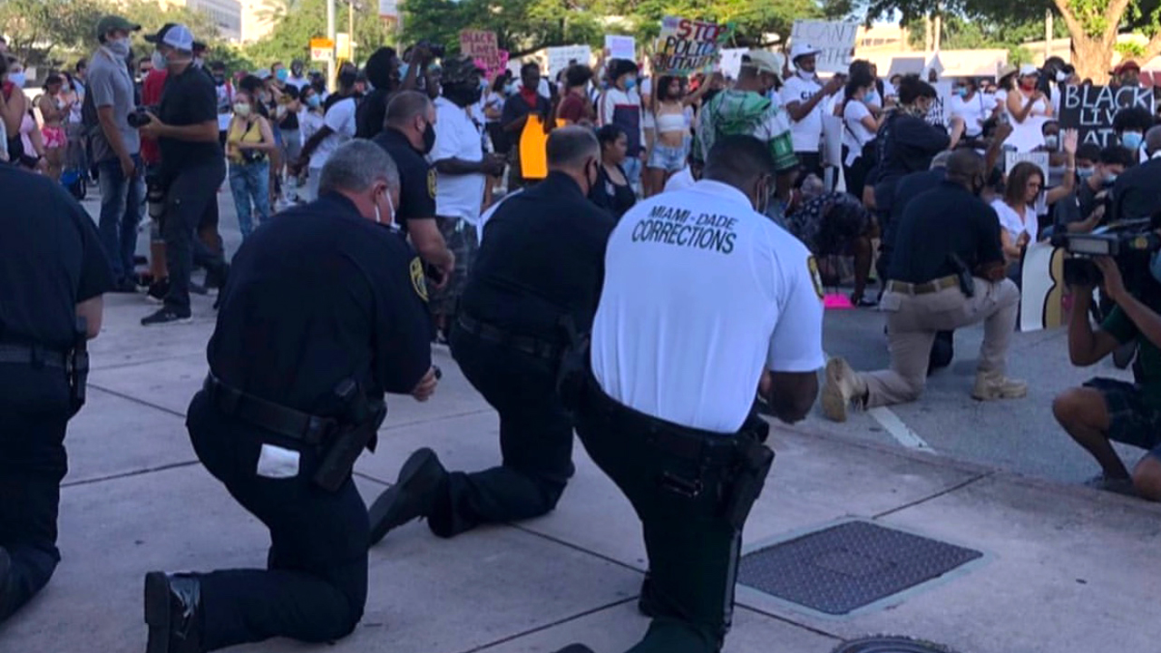 wptv-police-kneel-miami-dade-floyd-protest.jpg
