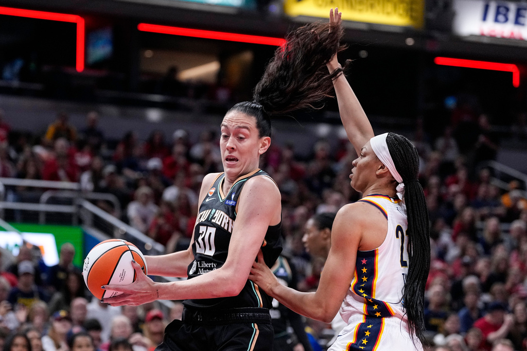Indiana Fever forward Makayla Timpson (21) defends New York Liberty forward Breanna Stewart (30) in the first half of a WNBA basketball game in Indianapolis, Tuesday, Aug. 11, 2026.